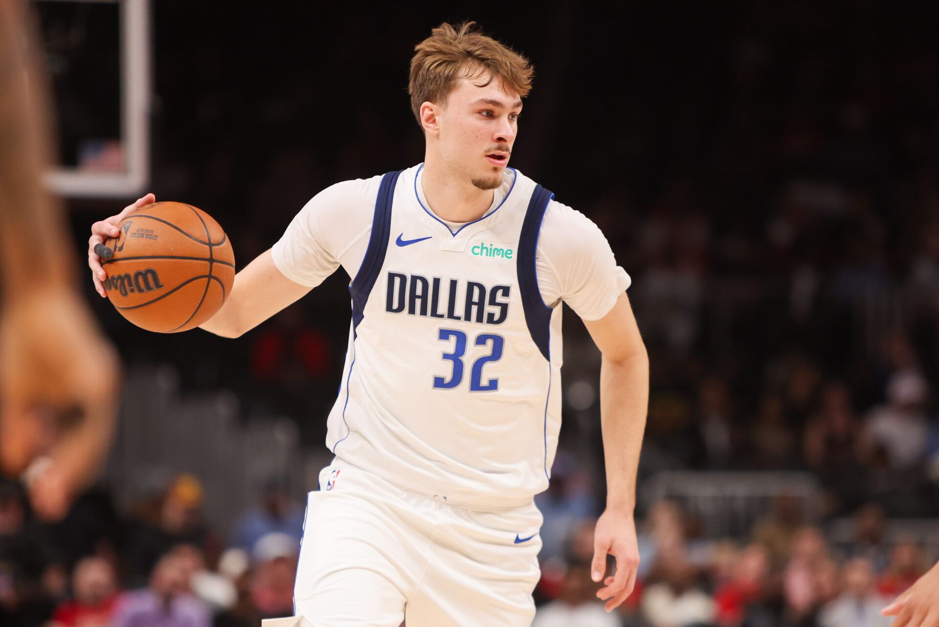Dallas Mavericks forward Cooper Flagg (32) dribbles against the Atlanta Hawks in the first quarter at State Farm Arena.