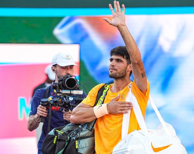 Carlos Alcaraz waves to fans as he departs Stadium 1 after his semifinal loss to Daniil Medvedev at the BNP Paribas Open in Indian Wells, Calif., Saturday, March 14, 2026.