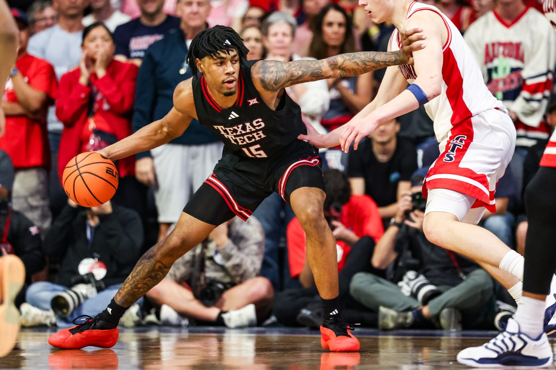 Texas Tech Red Raiders forward JT Toppin (15) dribbles the ball against the Arizona Wildcats during overtime at McKale Memorial Center.