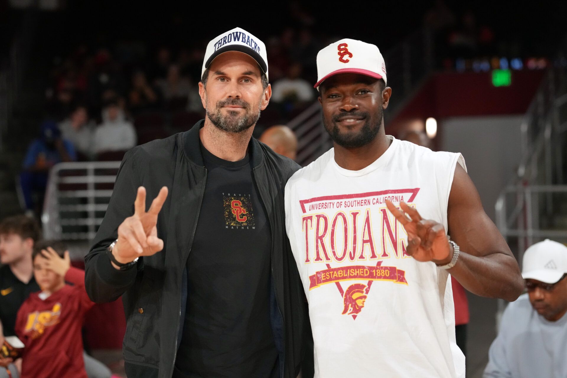 Matt Leinart (left) and Rai Benjamin pose during the game between the Maryland Terrapins and the Southern California Trojans at Galen Center.