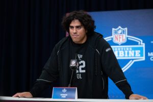 Utah offensive lineman Spencer Fano (OL22) speaks to members of the media during the NFL Combine at the Indiana Convention Center.