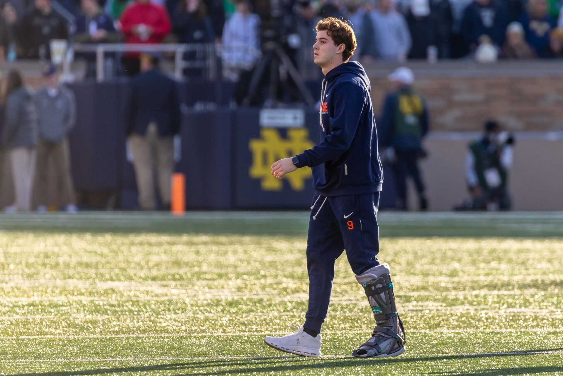 Injurred Syracuse Orange quarterback Steve Angeli (9) walks towards the bench after the coin toss against the Notre Dame Fighting Irish at Notre Dame Stadium.
