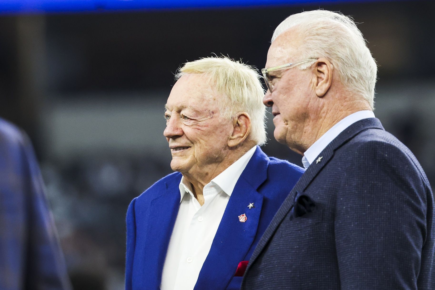 Dallas Cowboys co-owners Jerry Jones, left, and Stephen Jones, right, stand on the field during pregame warmups against the Los Angeles Chargers at AT&T Stadium.