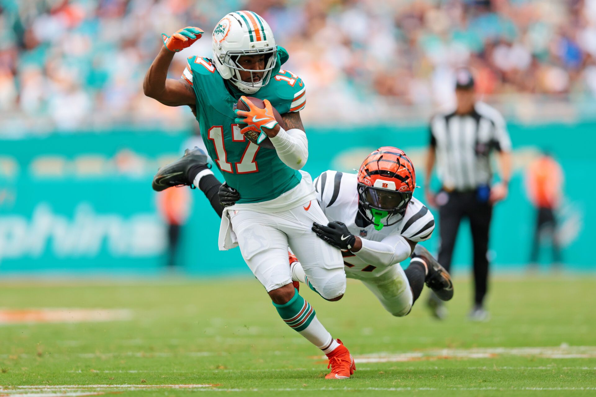 Miami Dolphins wide receiver Jaylen Waddle (17) runs the ball during the second quarter against the Cincinnati Bengals at Hard Rock Stadium.