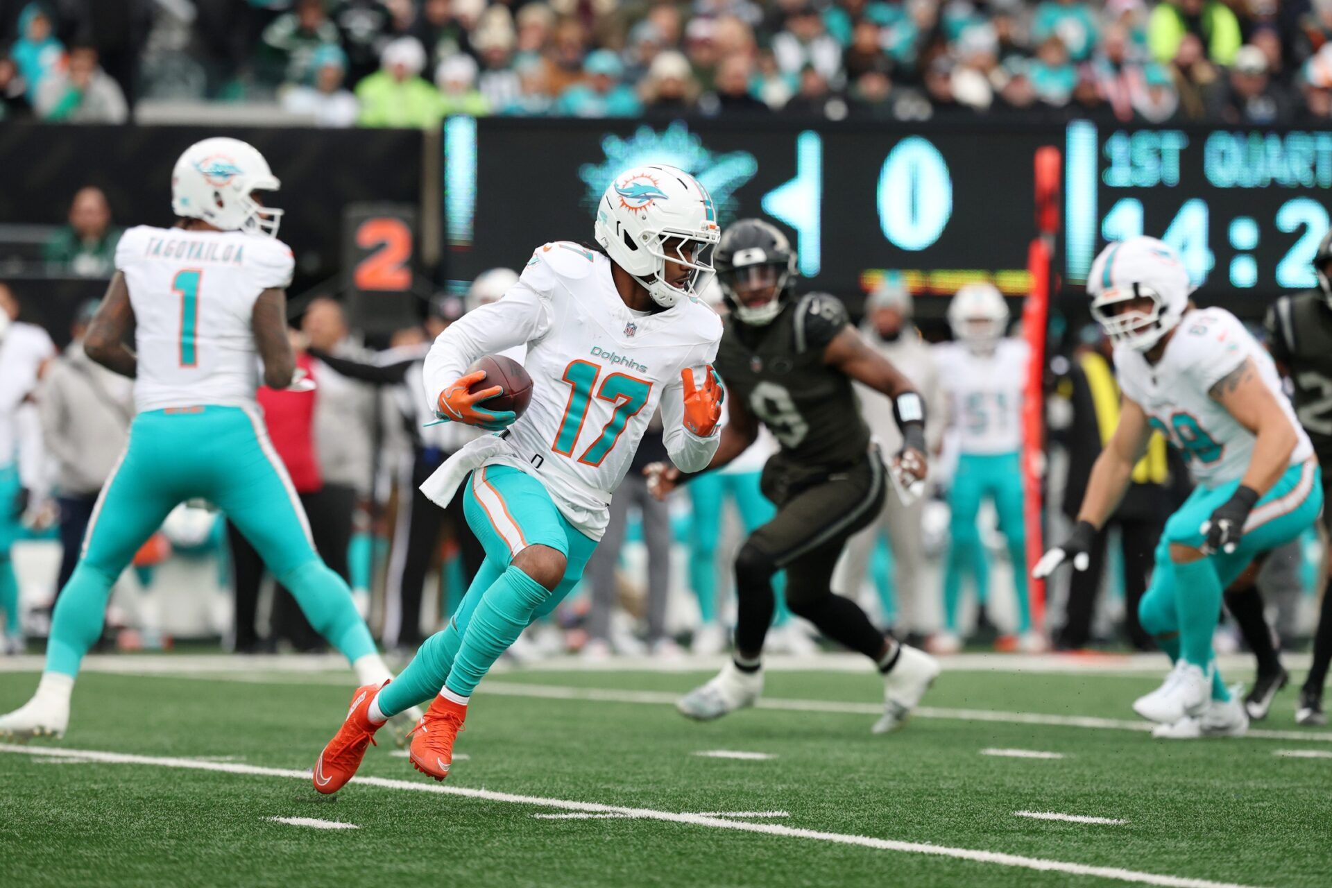 Miami Dolphins wide receiver Jaylen Waddle (17) runs with the ball against the New York Jets during the first half at MetLife Stadium.