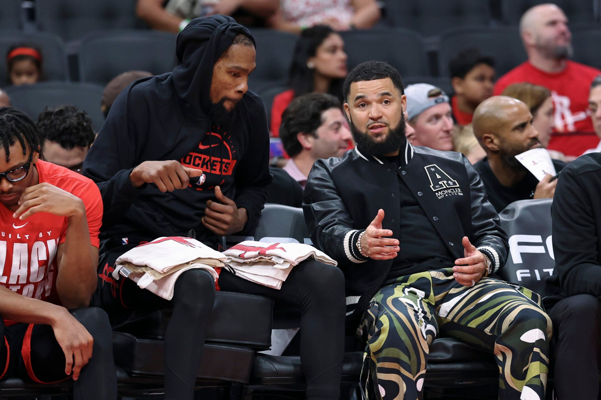 Houston Rockets guard Fred Vanvleet (right) talks with forward Kevin Durant on the bench during the third quarter against the Sacramento Kings at Toyota Center.