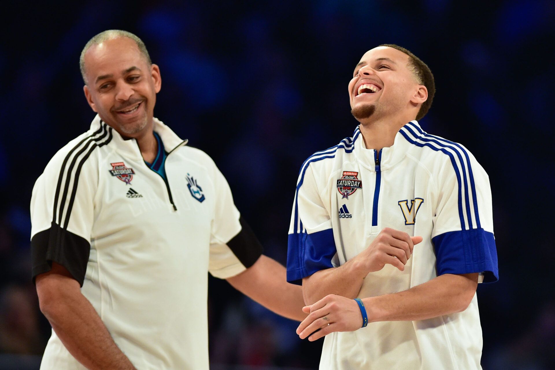 Team Curry legend Dell Curry (left) and Team Curry guard Stephen Curry of the Golden State Warriors (30, right) celebrate during the 2015 NBA All Star Shooting Stars competition at Barclays Center.