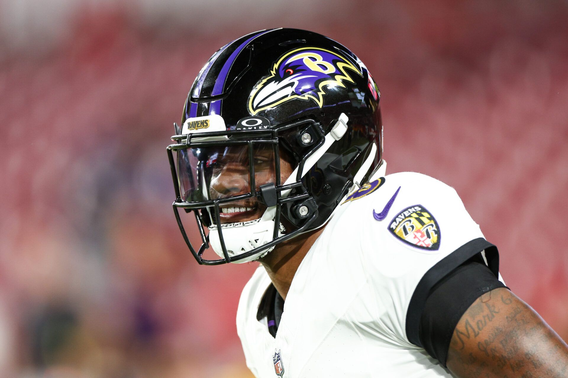 Baltimore Ravens quarterback Lamar Jackson (8) warms up before a game against the Tampa Bay Buccaneers at Raymond James Stadium.