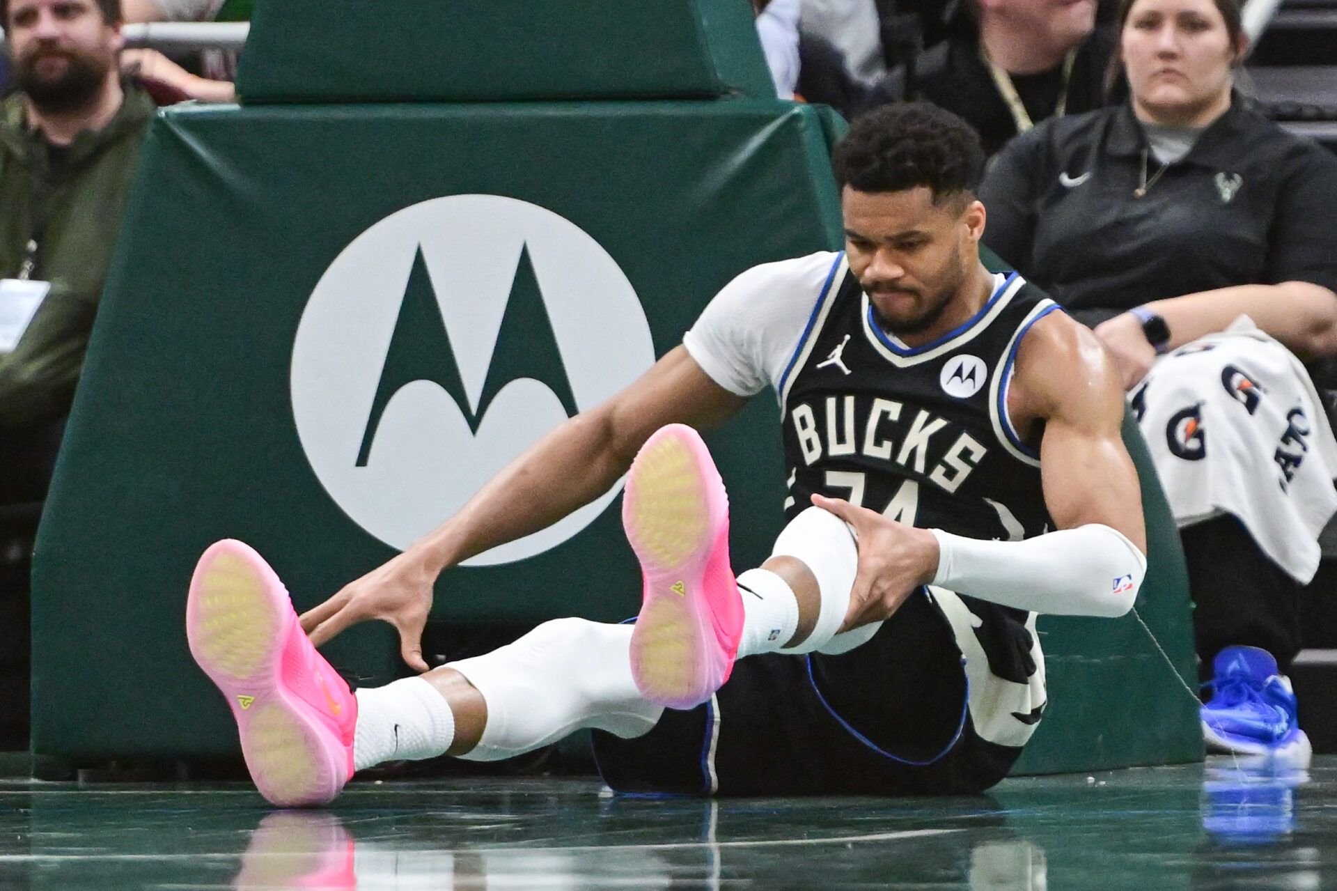 Milwaukee Bucks forward Giannis Antetokounmpo (34) holds his knee after dunking a basket against the Indiana Pacers in the third quarter and had to leave the game at Fiserv Forum.