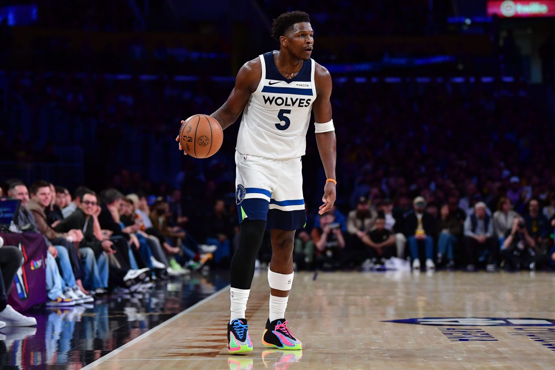 Minnesota Timberwolves guard Anthony Edwards (5) controls the ball against the Los Angeles Lakers during the second half at Crypto.com Arena.
