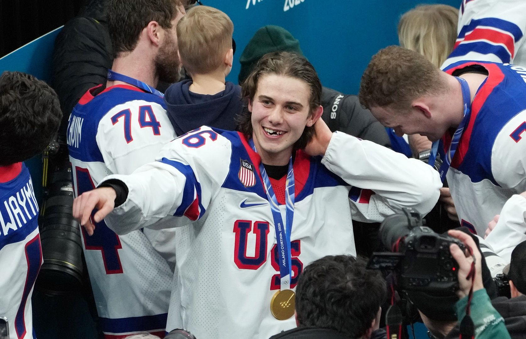 Jack Hughes of the United States celebrates after winning the men's ice hockey gold medal game during the Milano Cortina 2026 Olympic Winter Games at Milano Santagiulia Ice Hockey Arena.