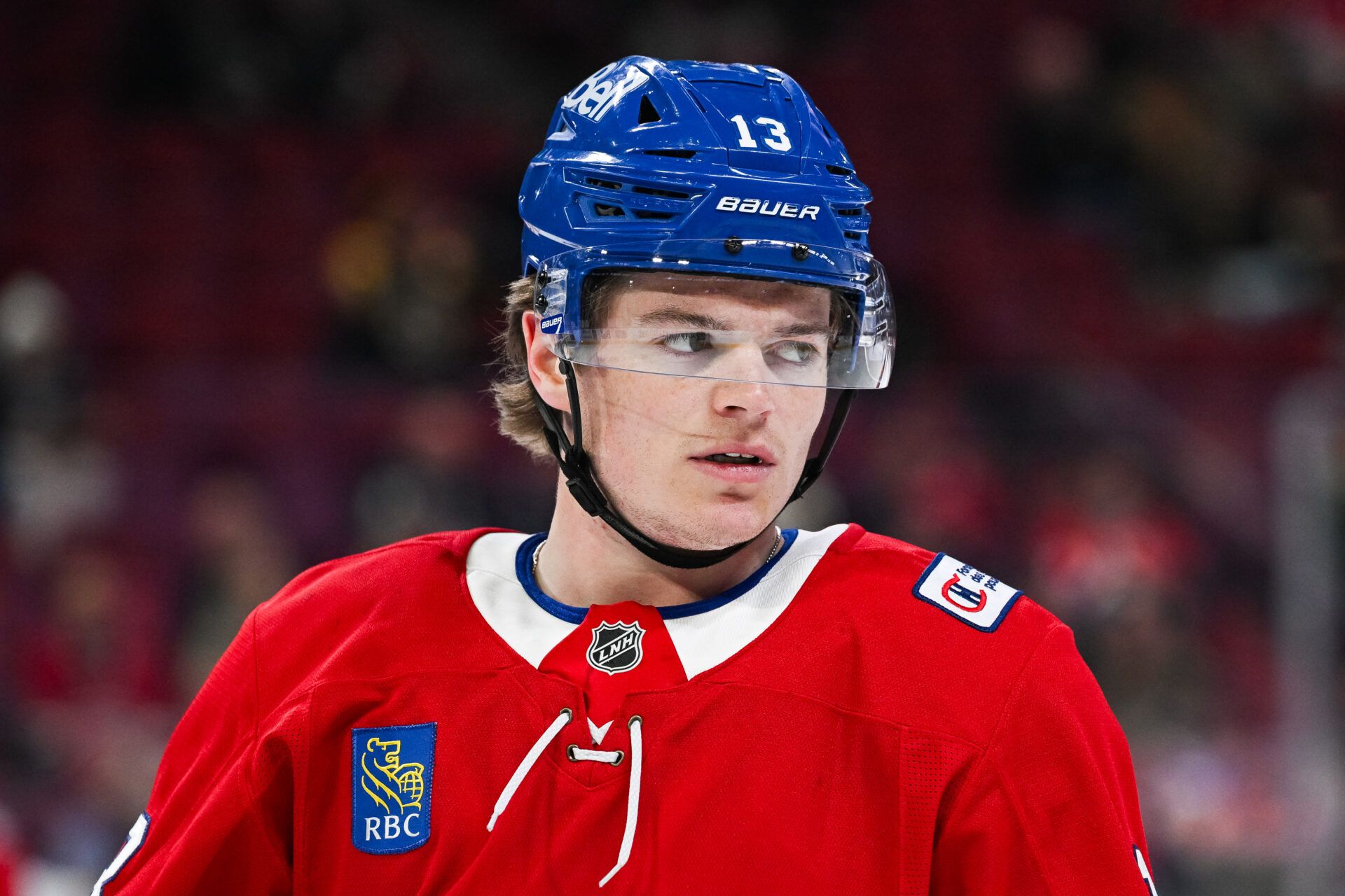 Montreal Canadiens right wing Cole Caufield (13) looks on during warm-up at Bell Centre.