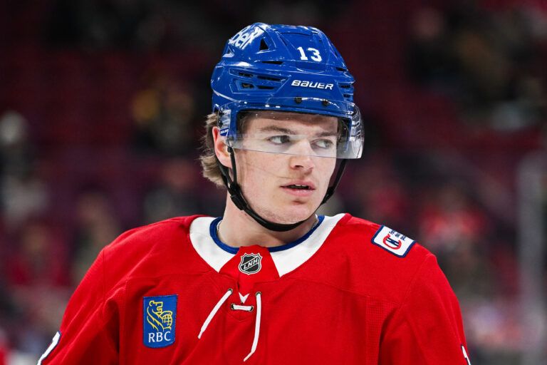 Montreal Canadiens right wing Cole Caufield (13) looks on during warm-up at Bell Centre.