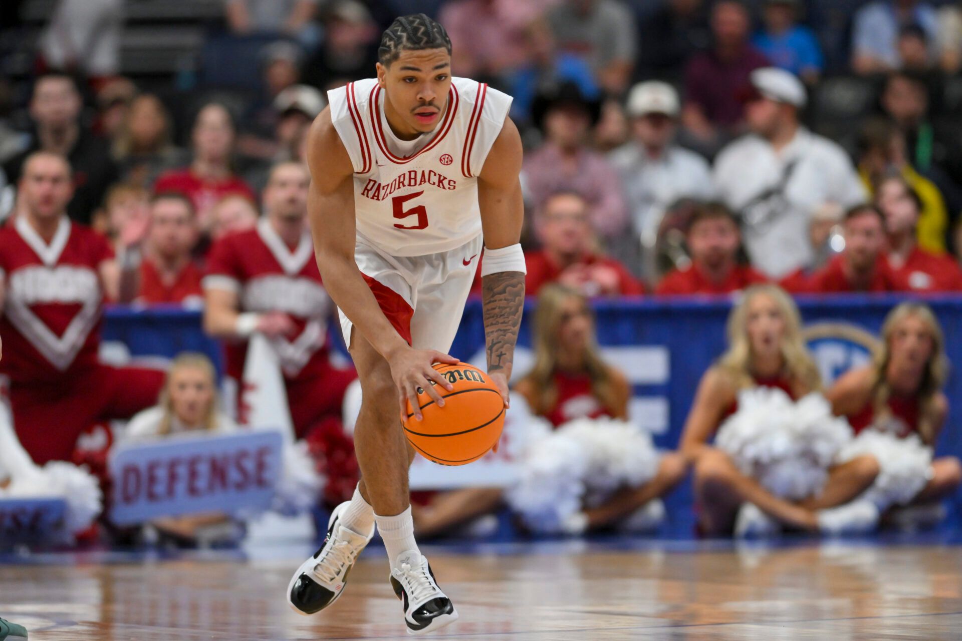 Arkansas Razorbacks guard Darius Acuff Jr. (5) brings the ball up court against the Mississippi Rebels during the first half at Bridgestone Arena.