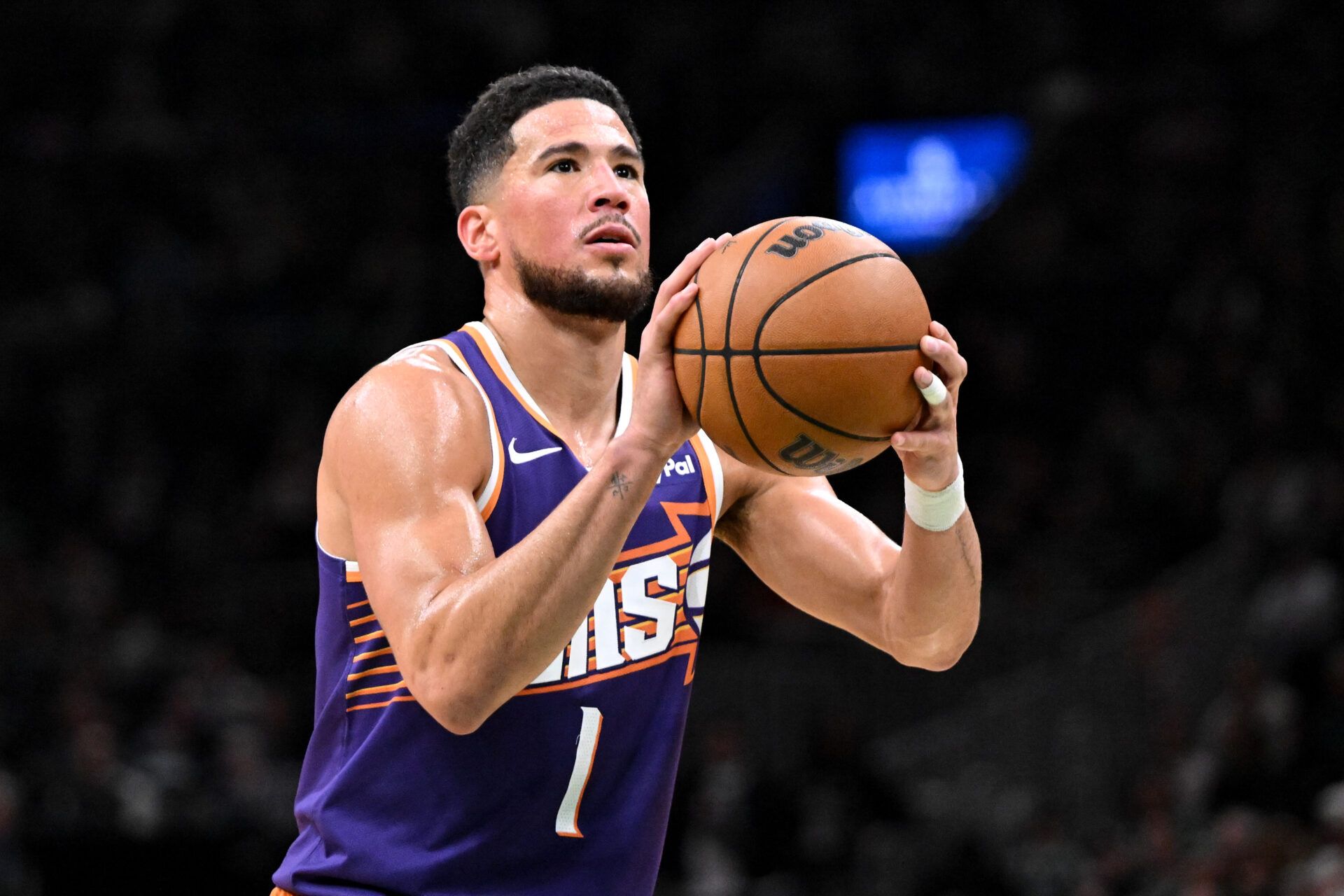 Phoenix Suns guard Devin Booker (1) attempts a free throw against the Boston Celtics during the first half at the TD Garden.