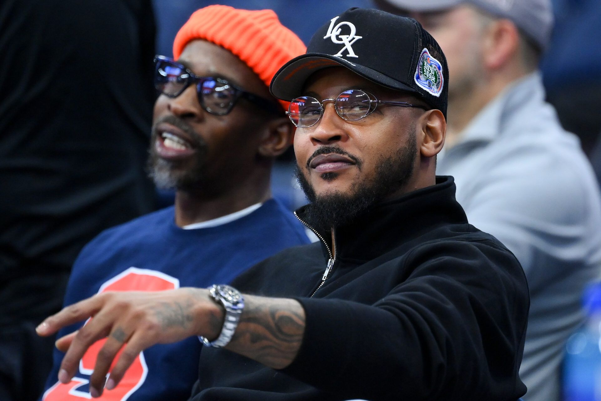Former professional basketball player Carmelo Anthony (right) looks on prior to the game between the Saint Joseph's Hawks and the Syracuse Orange at the JMA Wireless Dome.
