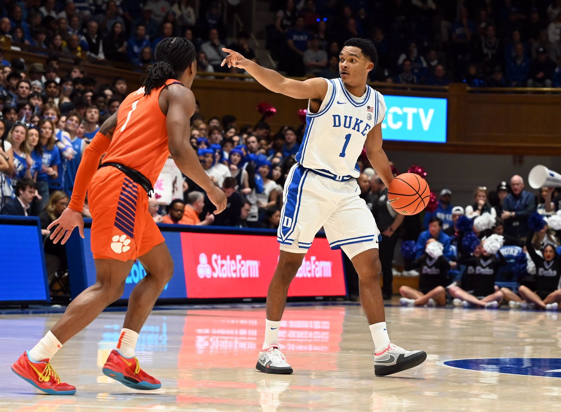 Duke Blue Devils guard Caleb Foster (1) directs the offense as Clemson Tigers guard Jestin Porter (1) defends during the second half at Cameron Indoor Stadium.
