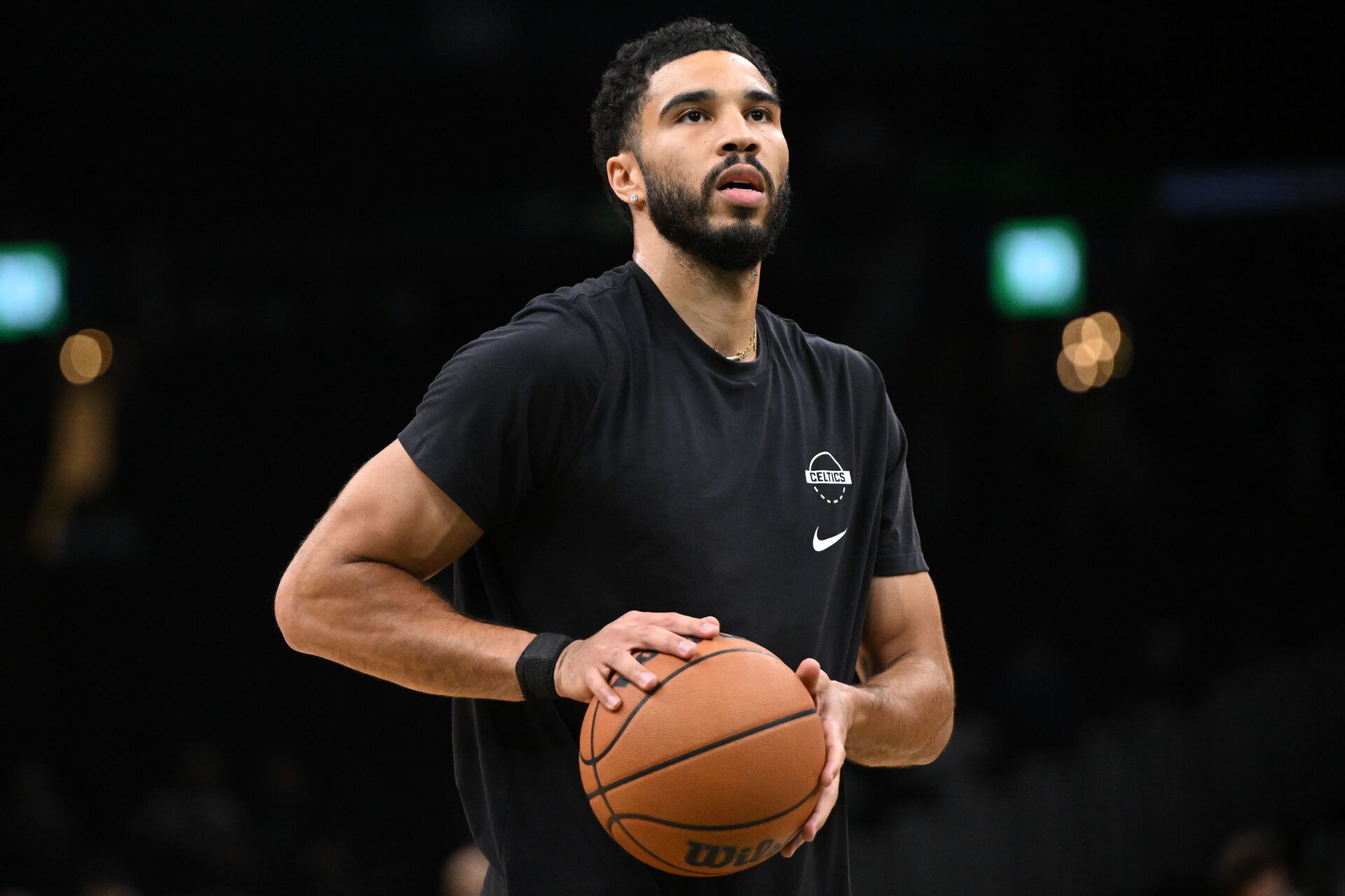 Boston Celtics forward Jayson Tatum (0) takes a shot during warmups before a game against the Phoenix Suns during the first half at the TD Garden.