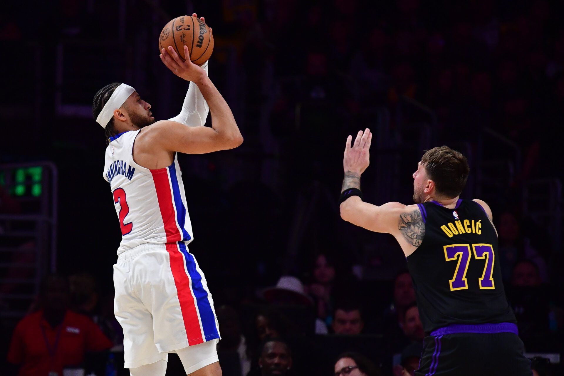 Detroit Pistons guard Cade Cunningham (2) shoots against Los Angeles Lakers guard Luka Doncic (77) during the second half at Crypto.com Arena.