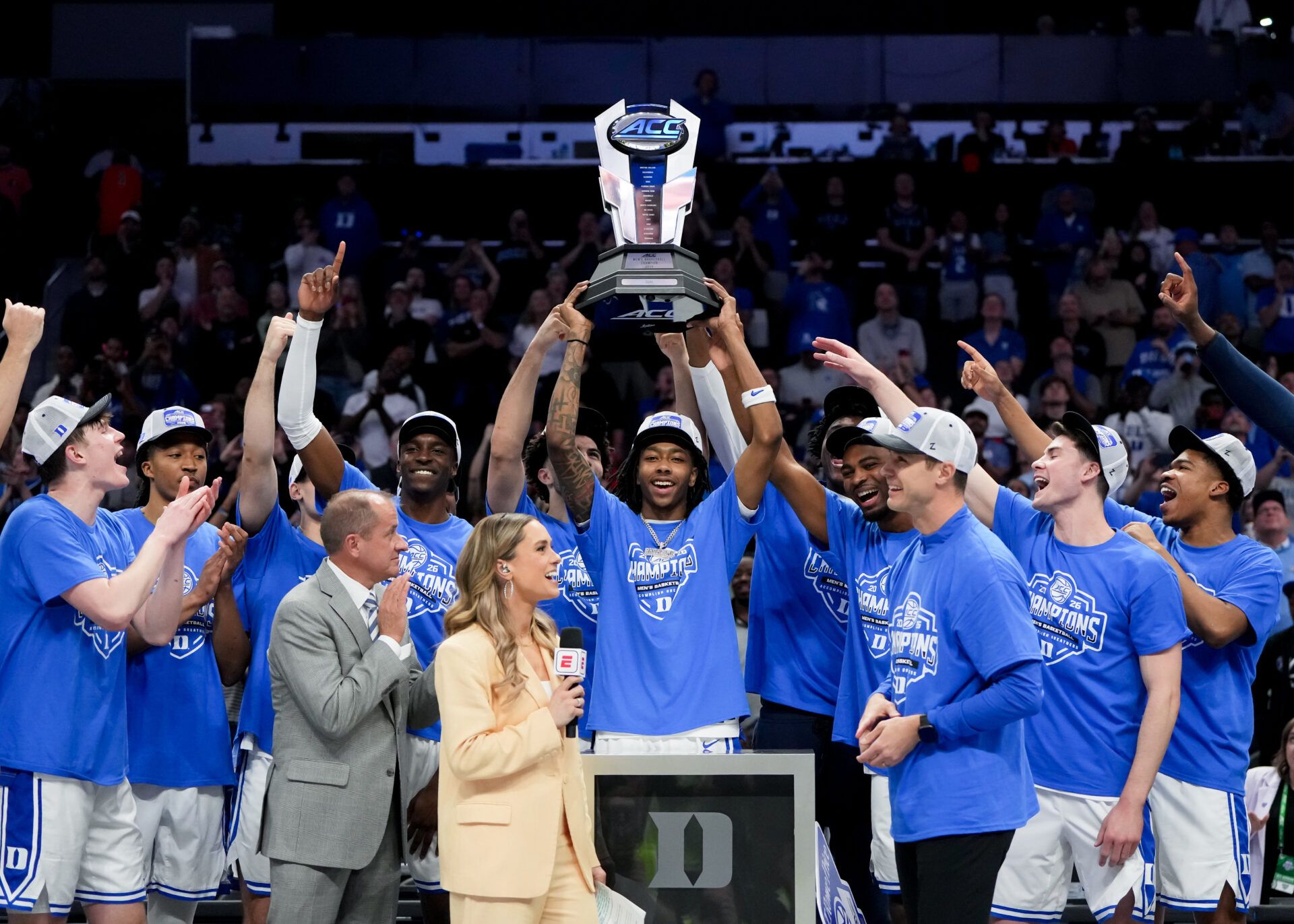 Duke Blue Devils guard Isaiah Evans (3) hoists the trophy after defeating the Virginia Cavaliers in the men's ACC Conference Tournament Championship at Spectrum Center.
