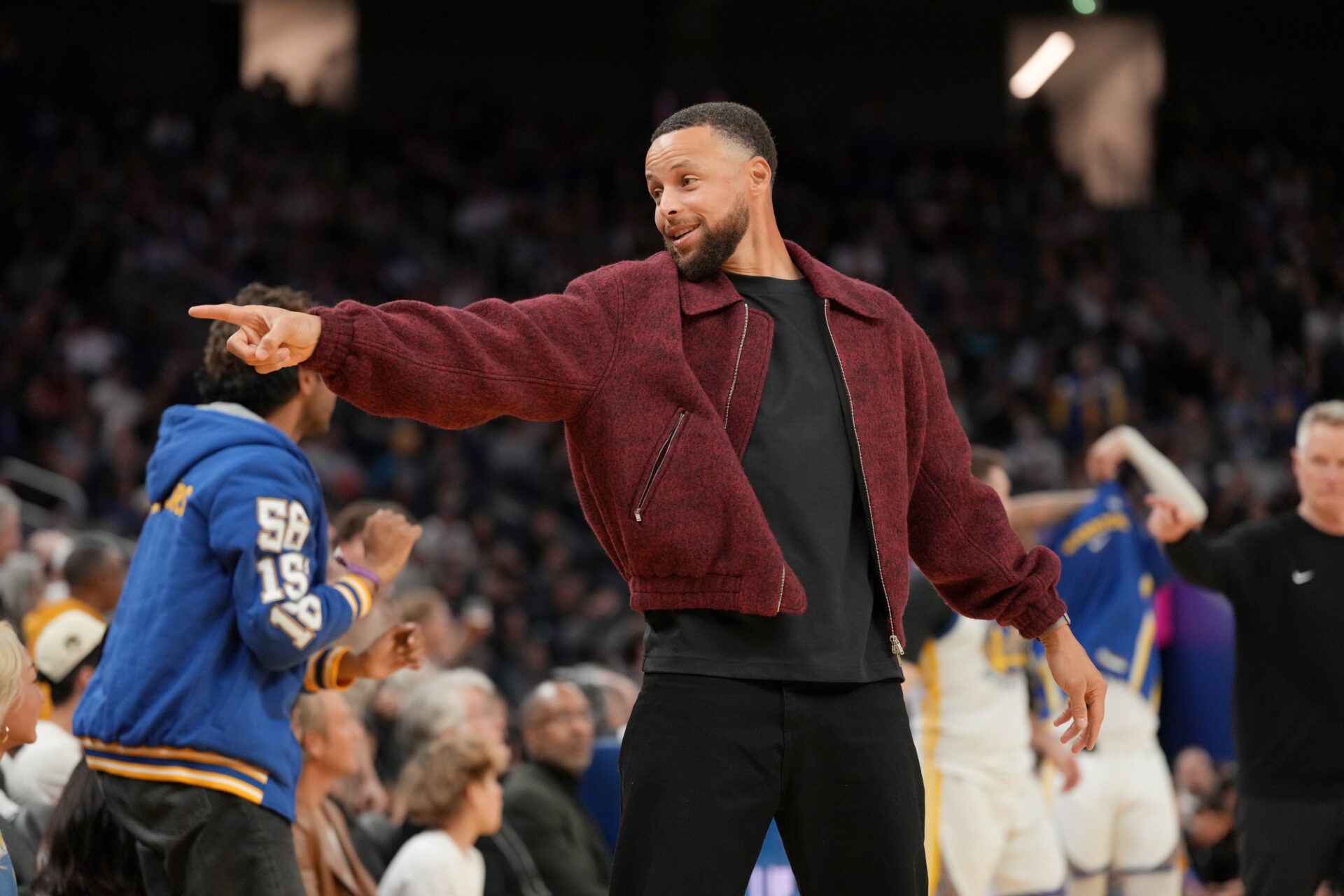 Golden State Warriors guard Stephen Curry (30) points towards the team bench after the Warriors were called for a foul against the Minnesota Timberwolves in the fourth quarter at the Chase Center.
