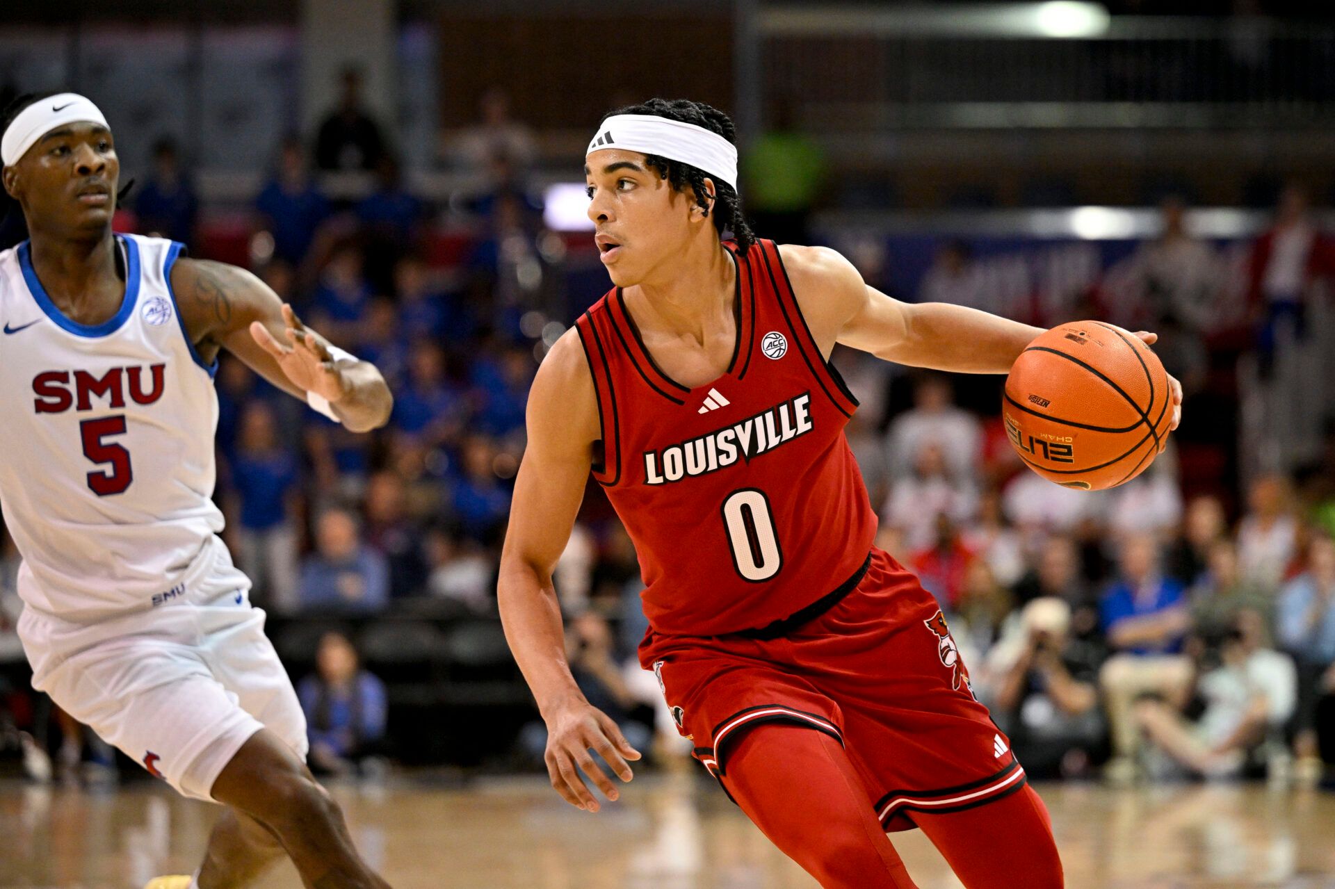Louisville Cardinals guard Mikel Brown Jr. (0) brings the ball up court against the SMU Mustangs during the first half at Moody Coliseum.