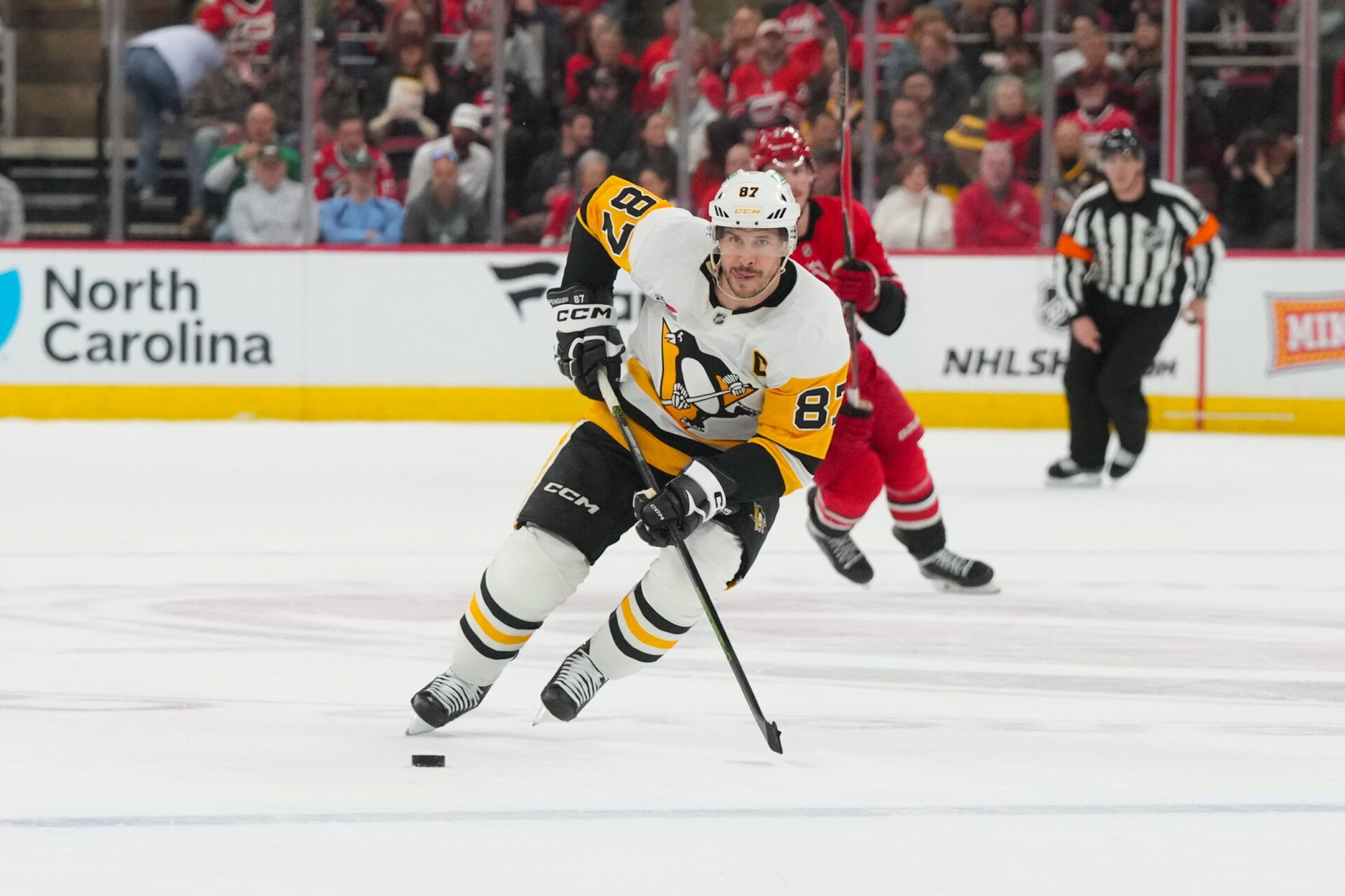 Pittsburgh Penguins center Sidney Crosby (87) skates with the puck against the Carolina Hurricanes during the second period at Lenovo Center.