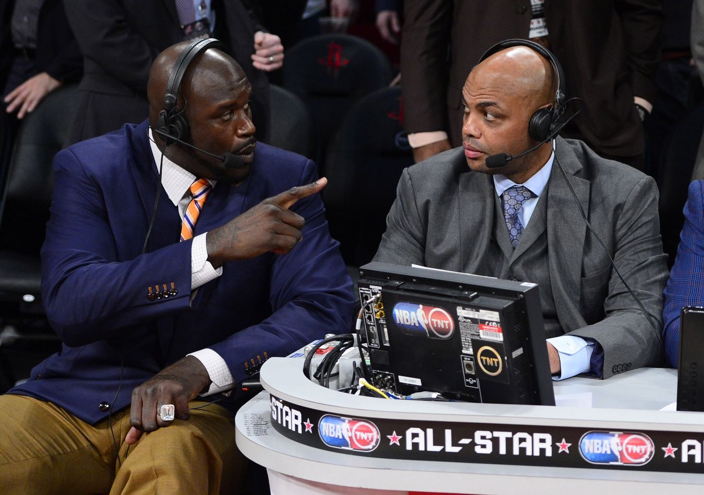 TNT broadcaster Shaquille O'Neal (left) and Charles Barkley talk during the 2013 NBA All-Star slam dunk contest at the Toyota Center.