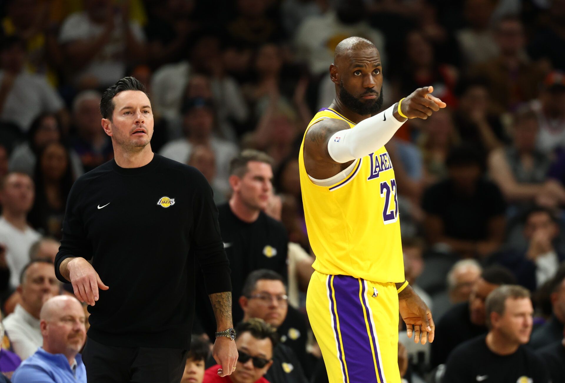 Los Angeles Lakers head coach JJ Redick with forward LeBron James (23) against the Phoenix Suns in the first half at Mortgage Matchup Center.