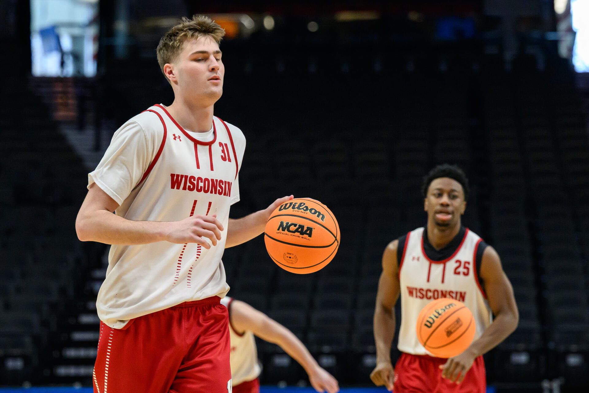Wisconsin Badgers forward Nolan Winter (31) dribbles the ball during a practice session ahead of the first round of the men's 2026 NCAA Tournament at Moda Center.