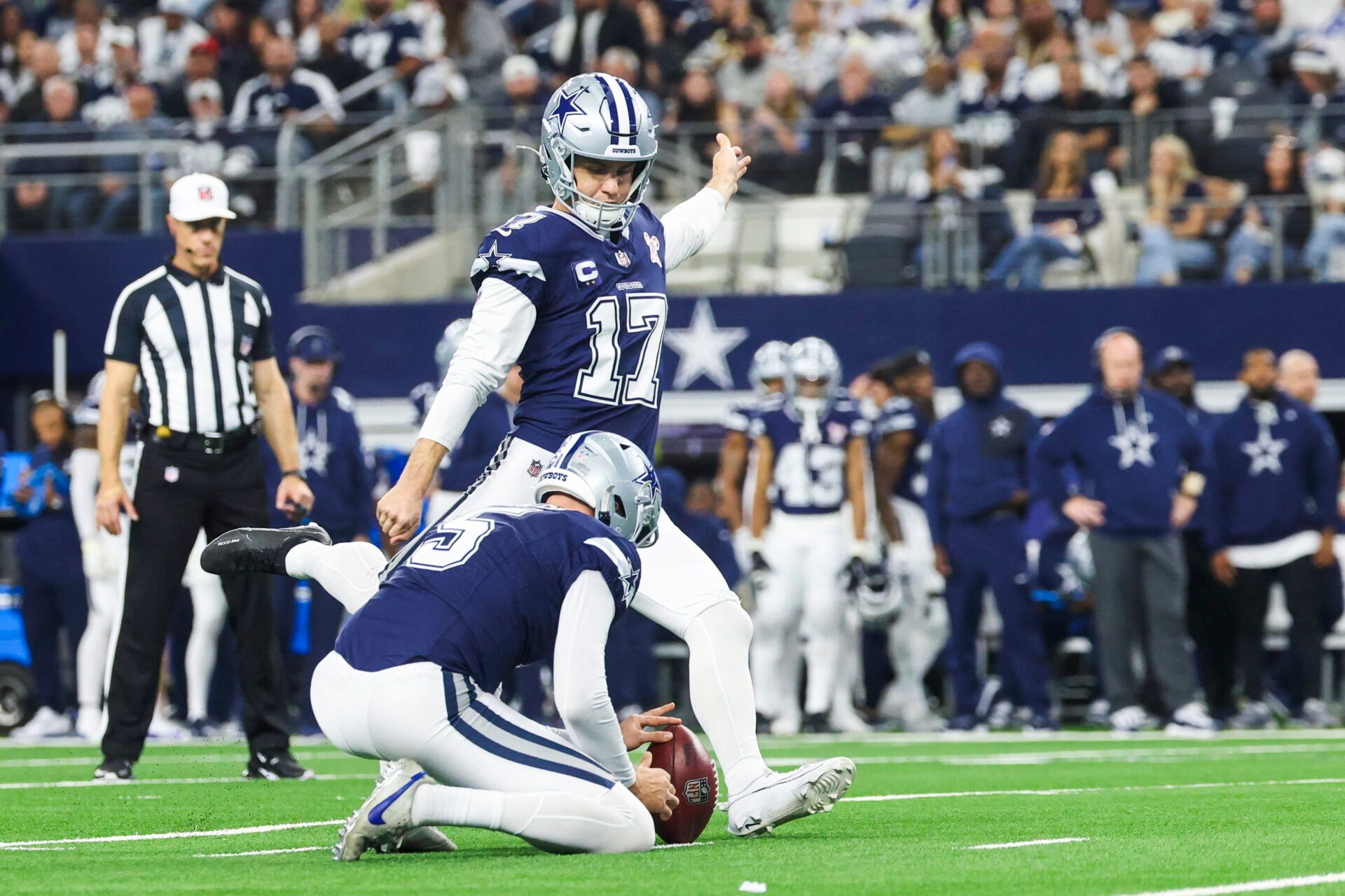 Dallas Cowboys place kicker Brandon Aubrey (17) kicks a field goal against the Los Angeles Chargers during the first half at AT&T Stadium.