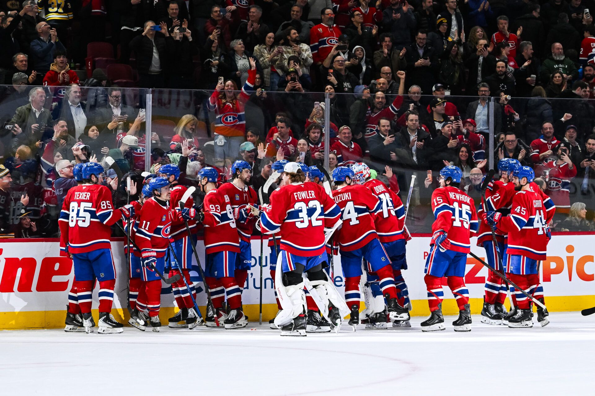 Montreal Canadiens players gather together to celebrate their win against the Boston Bruins after the end of the game at Bell Centre.