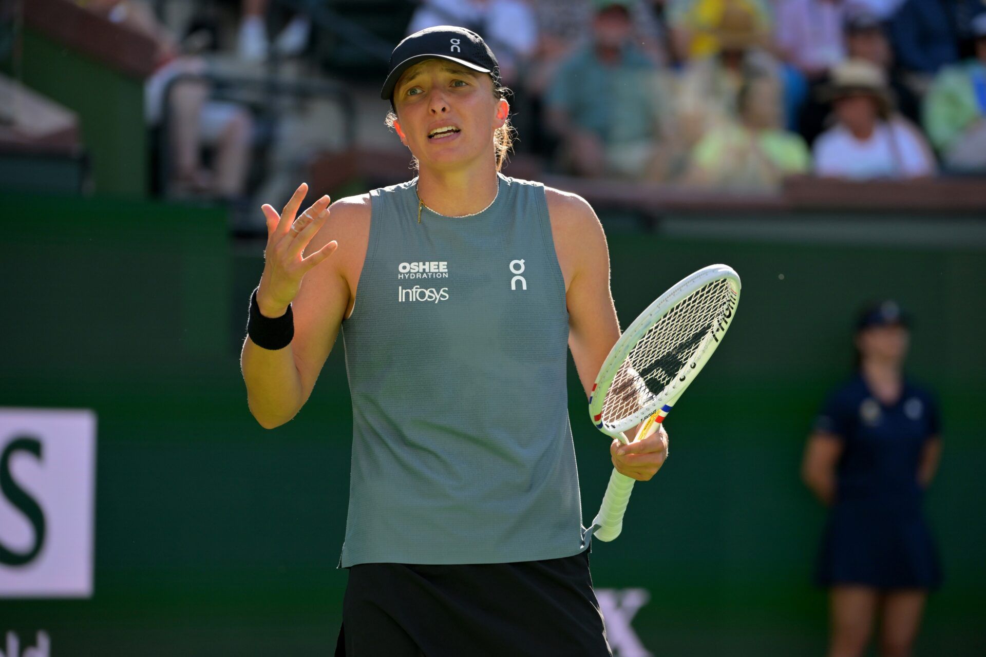 Iga Swiatek (POL) shows some frustration in her quarterfinal against Elina Svitolina (UKR) during the BNP Paribas Open at the Indian Wells Tennis Garden.