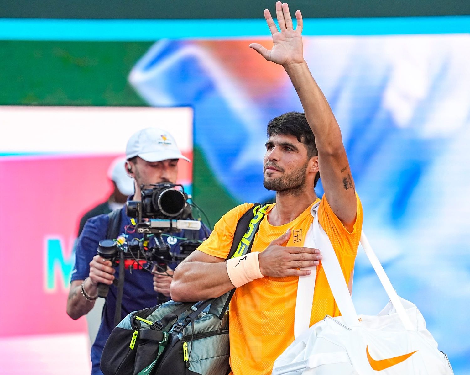 Carlos Alcaraz waves to fans as he departs Stadium 1 after his semifinal loss to Daniil Medvedev at the BNP Paribas Open in Indian Wells, Calif., Saturday, March 14, 2026.