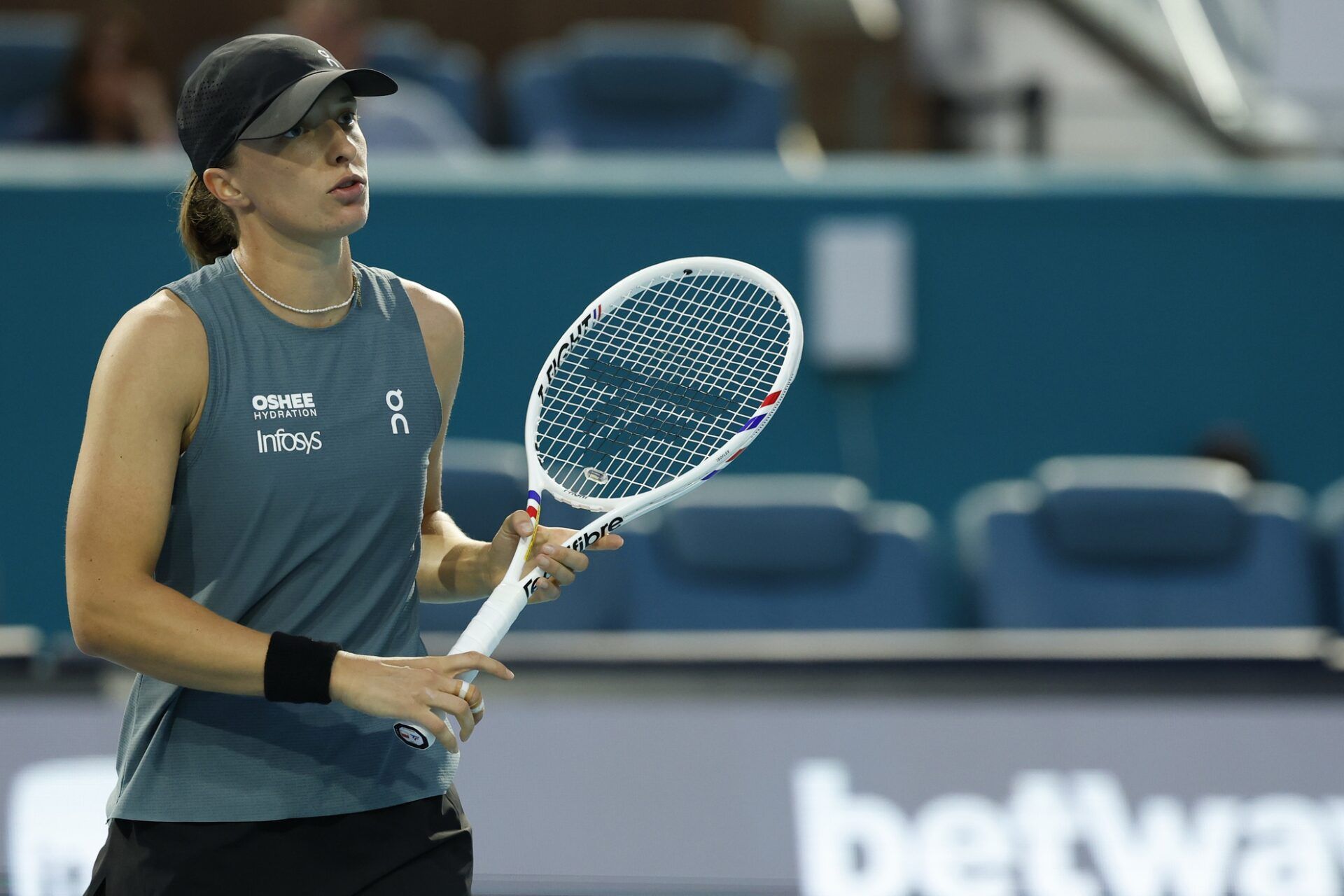 Iga Swiatek (POL) reacts after missing a shot against Magda Linette (POL) (not pictured) on day three of the 2026 Miami Open at Hard Rock Stadium.