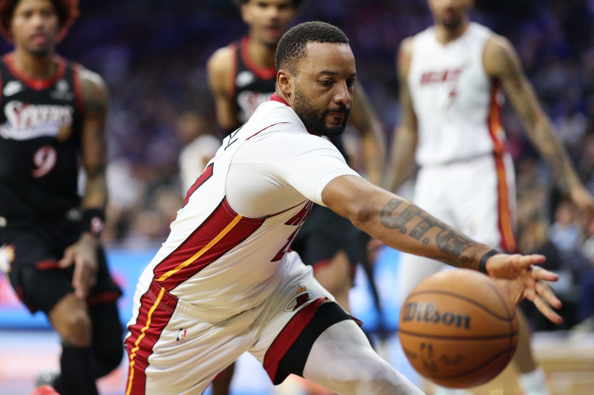 Miami Heat guard Norman Powell (24) reaches for a loose ball against the Philadelphia 76ers during the second quarter at Xfinity Mobile Arena.