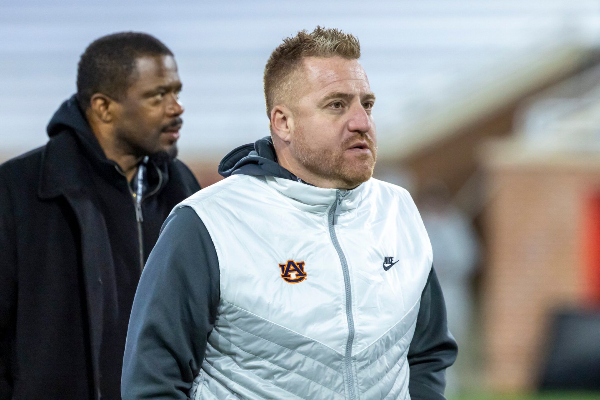 Auburn head football coach Alex Golesh visits the field during American Senior Bowl practice at Hancock Whitney Stadium.