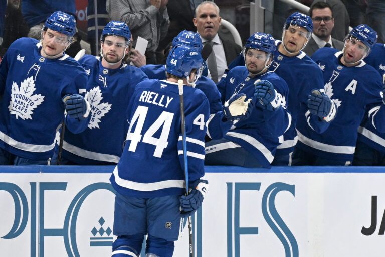 Toronto Maple Leafs defenseman Morgan Rielly (44) celebrates with team mates at the bench after scoring a goal against the Ottawa Senators in the first period at Scotiabank Arena.