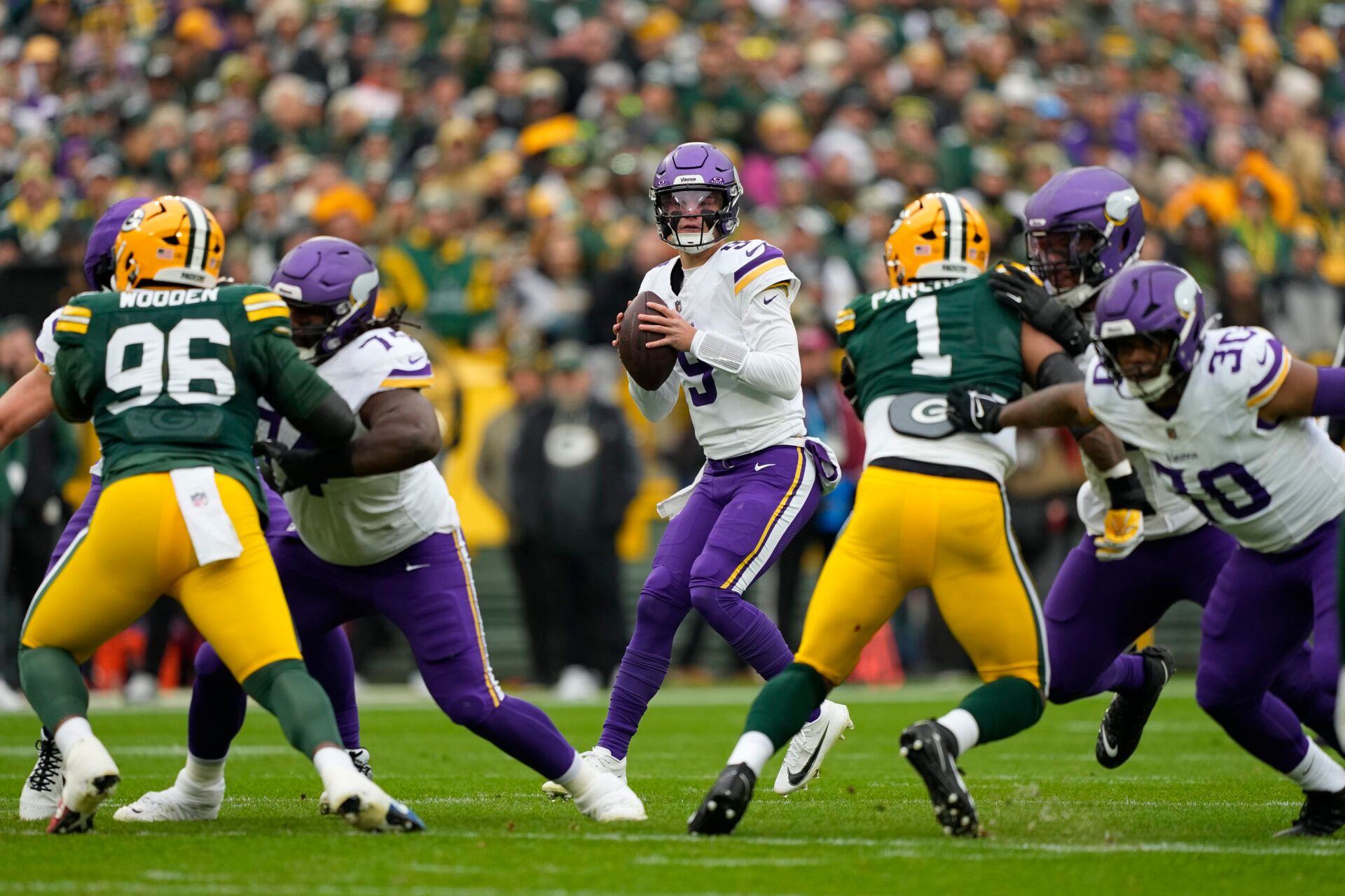 Minnesota Vikings quarterback J.J. McCarthy (9) stands in the pocket against the Green Bay Packers during the first half at Lambeau Field.
