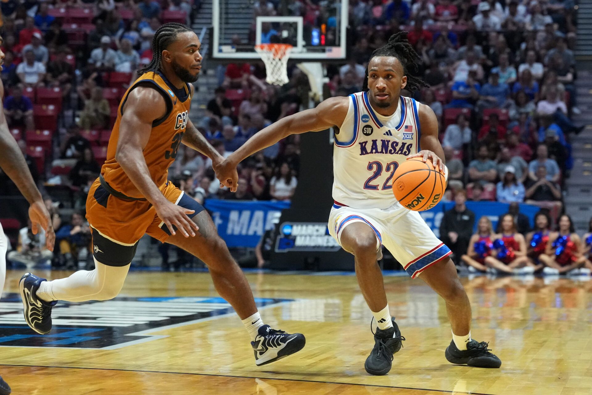Kansas Jayhawks guard Darryn Peterson (22) controls the ball against California Baptist Lancers guard Martel Williams (33) in the first half during a first round game of the men's 2026 NCAA Tournament at Viejas Arena.