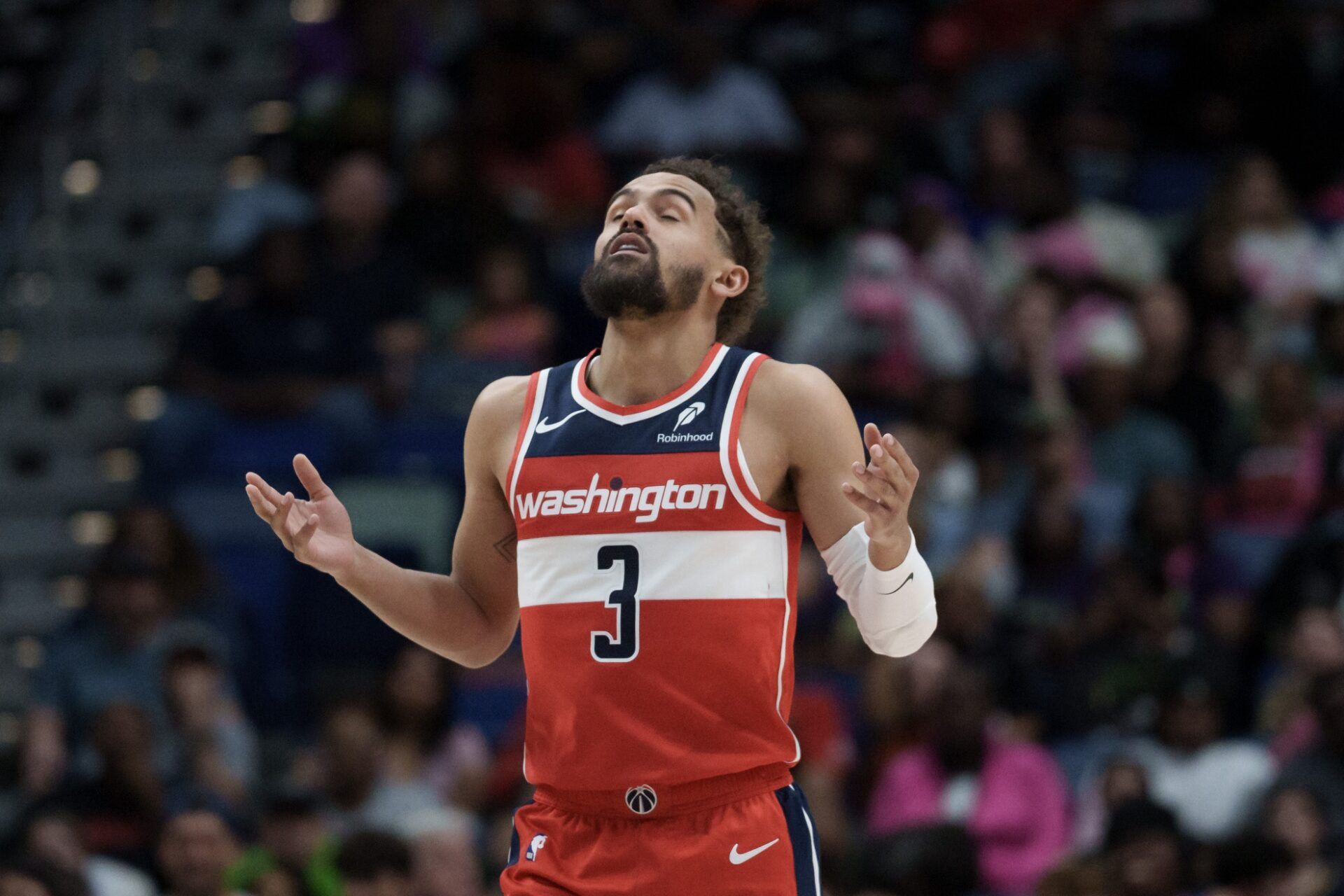 Washington Wizards guard Trae Young (3) reacts after a three-point basket against the New Orleans Pelicans during the first half at Smoothie King Center.