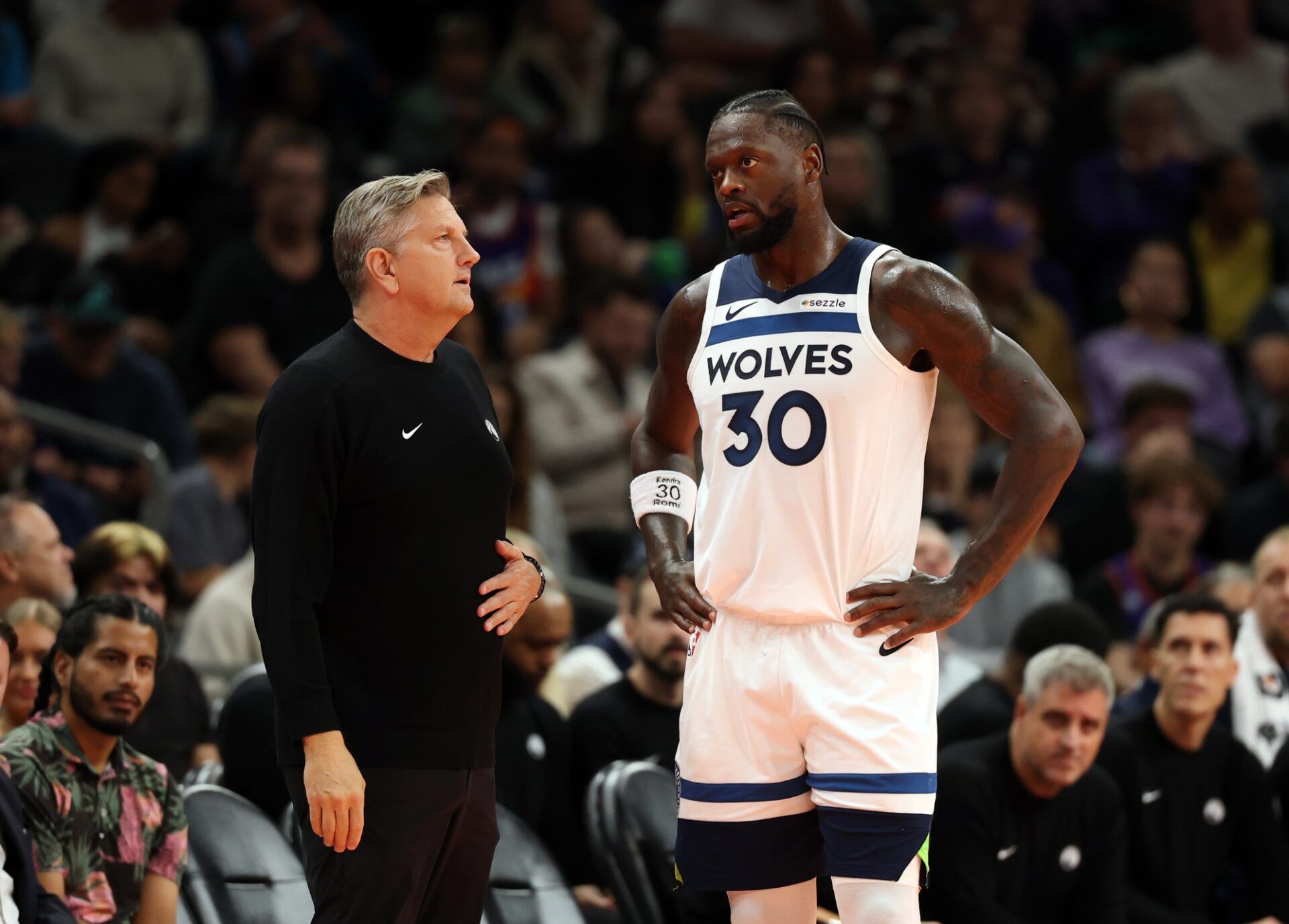 Minnesota Timberwolves head coach Chris Finch with forward Julius Randle (30) against the Phoenix Suns during an NBA Cup game at Mortgage Matchup Center.