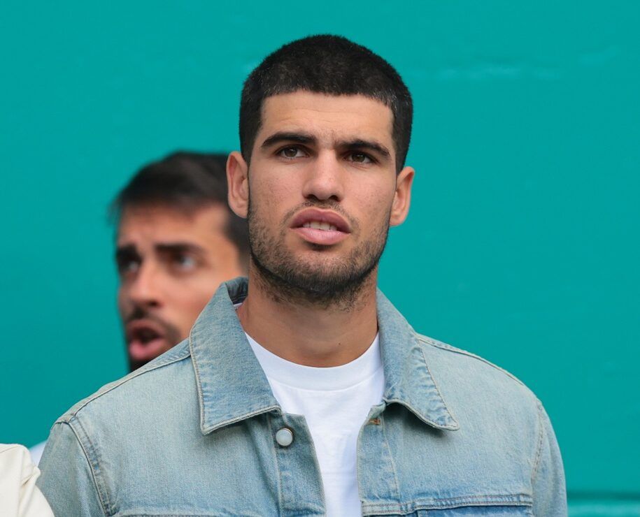 Carlos Alcaraz (right) the current world number one men's tennis player takes in the NFL game between the Miami Dolphins and New Orleans Saints during the second half at Hard Rock Stadium.