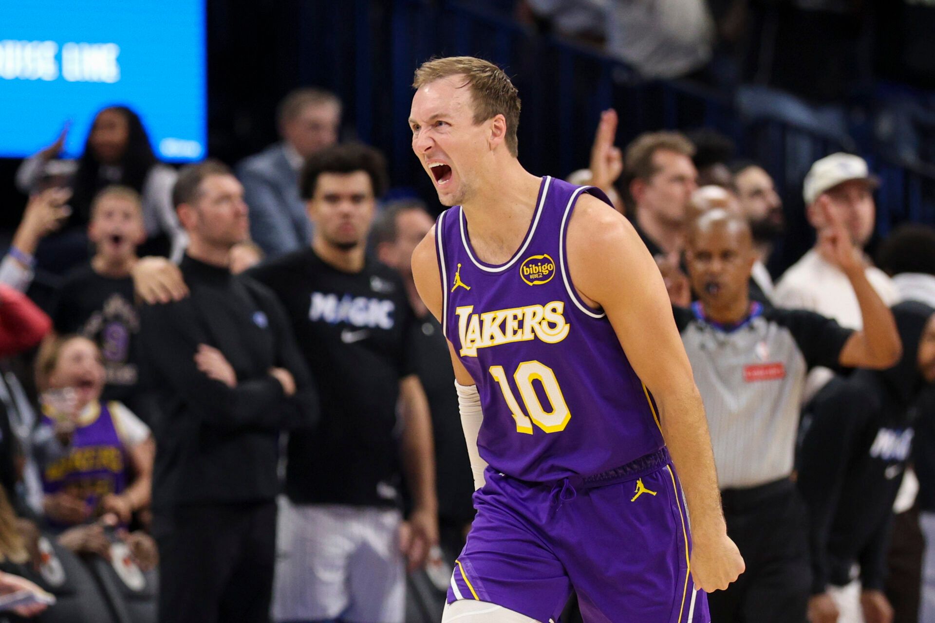 Los Angeles Lakers guard Luke Kennard (10) reacts after hitting a game winning basket at the buzzer against the Orlando Magic in the fourth quarter at Kia Center.
