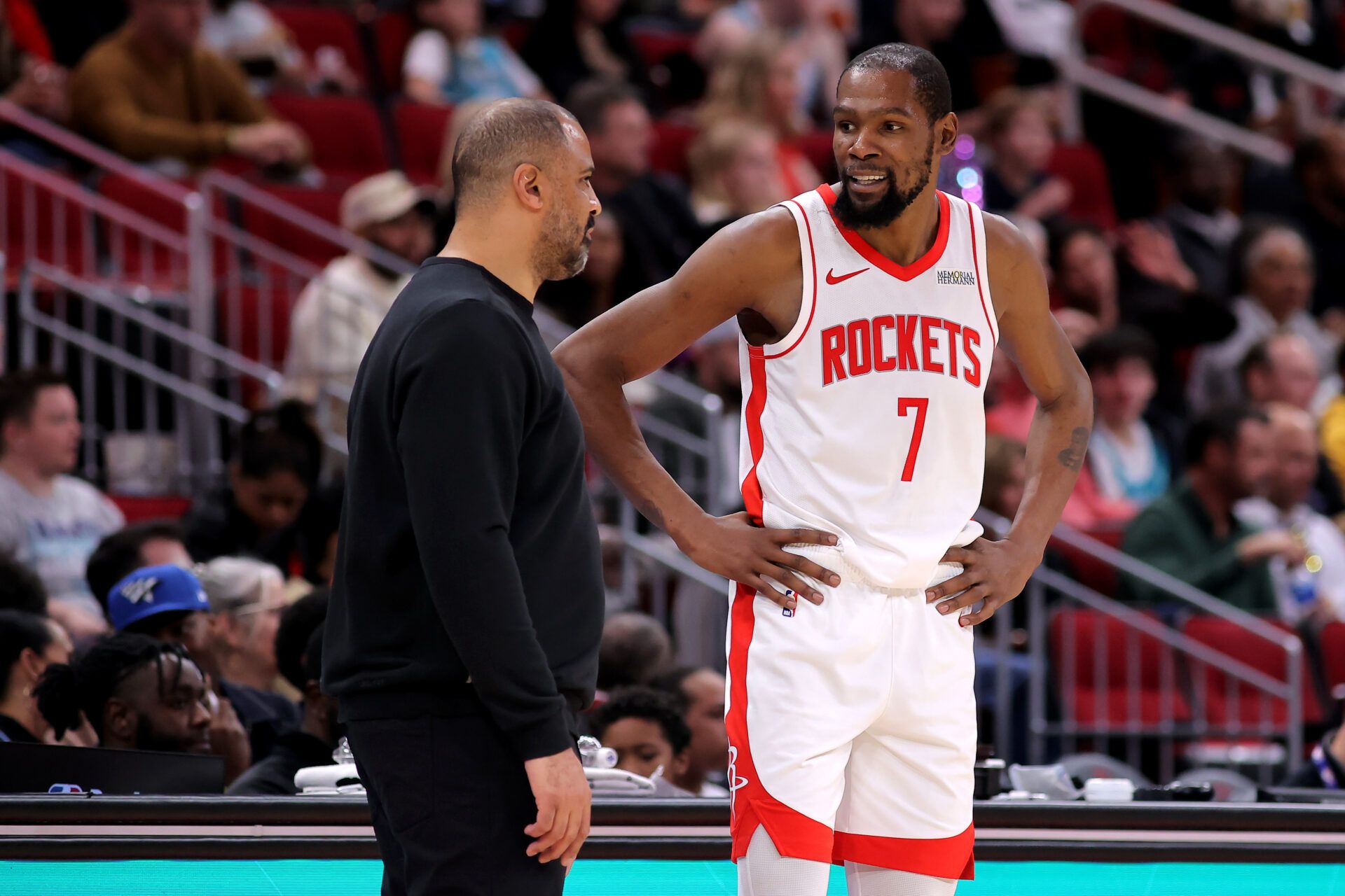 Houston Rockets head coach Ime Udoka talks with Houston Rockets forward Kevin Durant (7) against the Charlotte Hornets during the third quarter at Toyota Center.