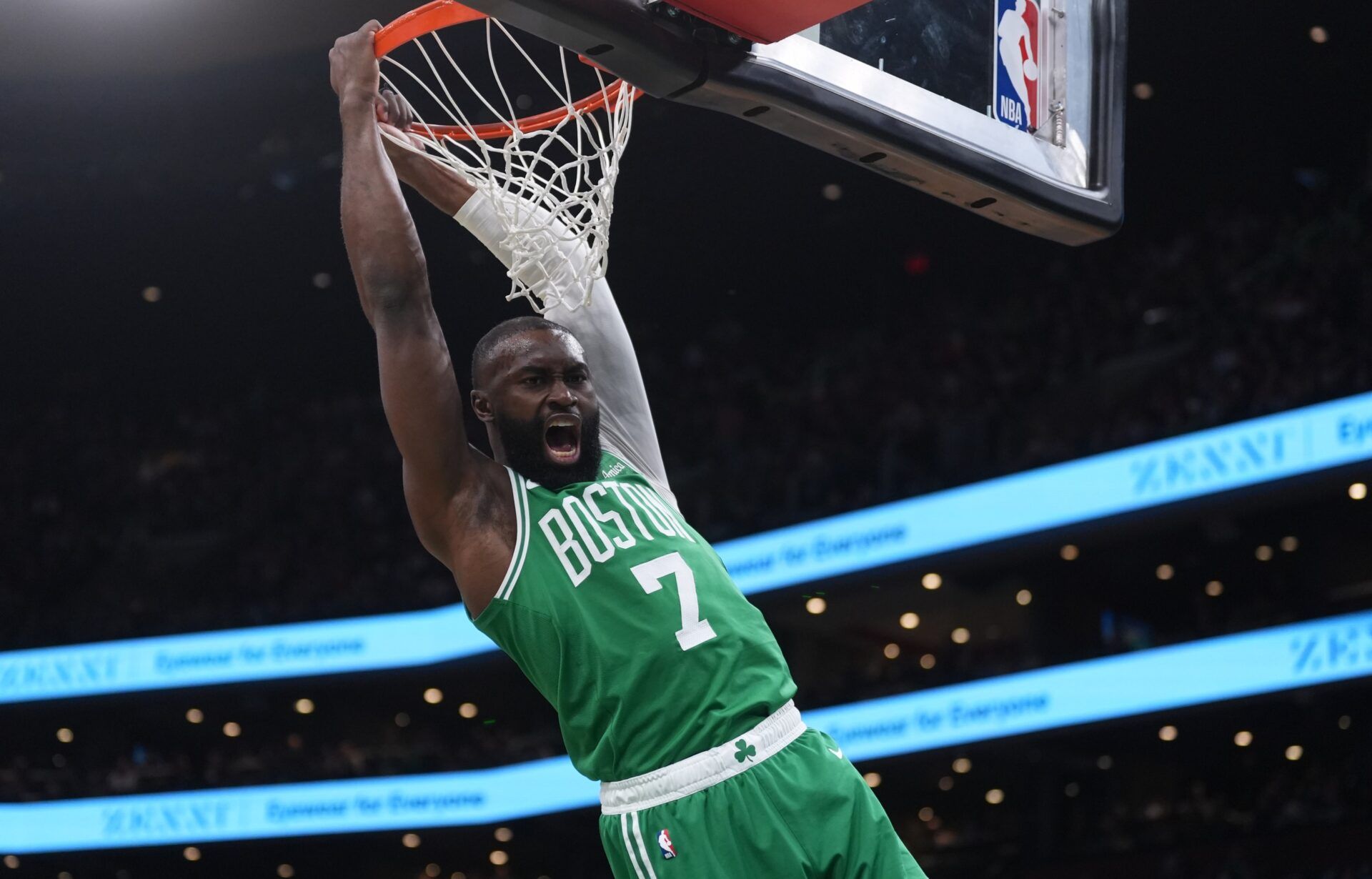 Boston Celtics guard Jaylen Brown (7) makes the basket against the Golden State Warriors  in the first quarter at TD Garden.