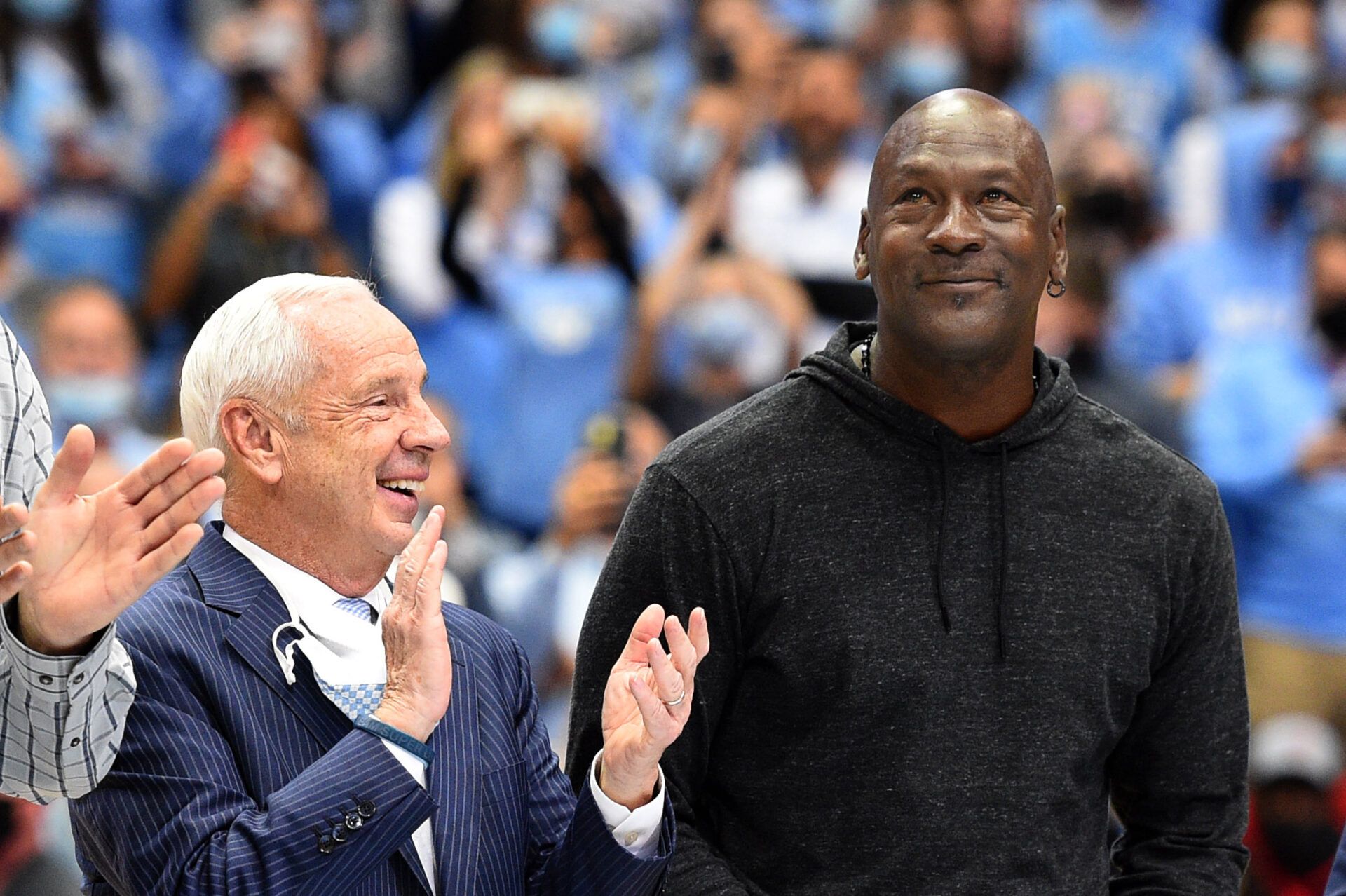 Former North Carolina Tar Heels head coach Roy Williams with former UNC great Michael Jordan on the court as they were honored as part of the 1982 national championship team in the second half at Dean E. Smith Center.