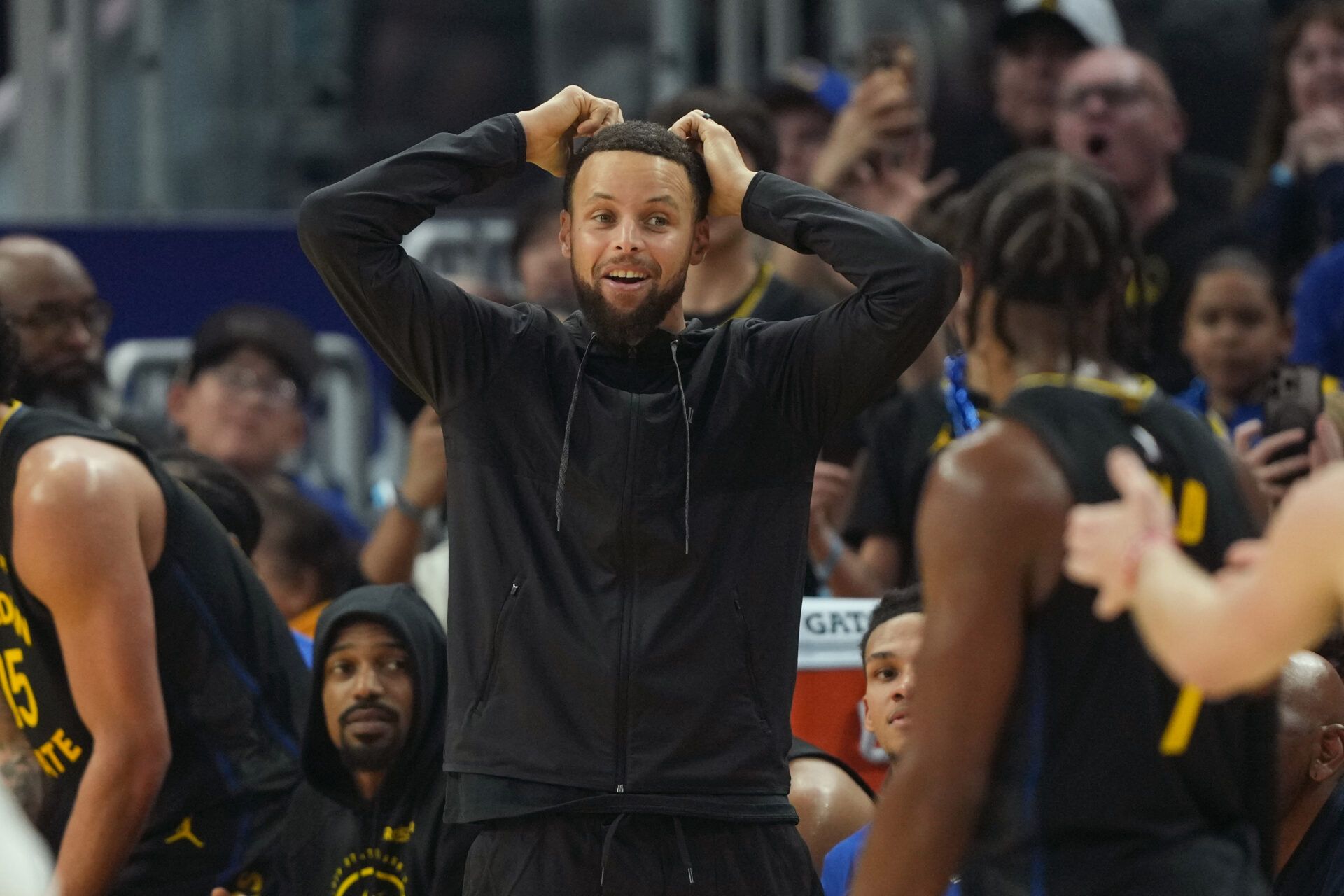 Golden State Warriors guard Stephen Curry (center) reacts after a foul call against center Al Horford (not shown) during the first quarter against the Oklahoma City Thunder at Chase Center.