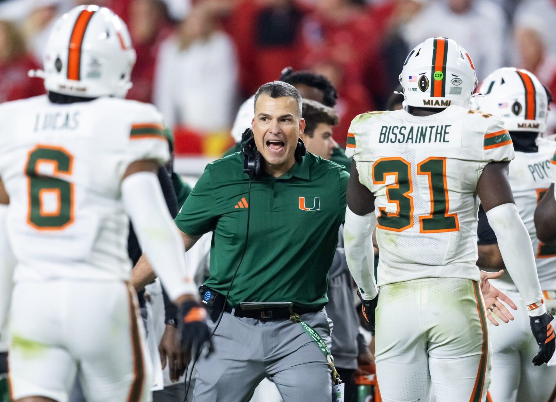 Miami Hurricanes head coach Mario Cristobal with linebacker Wesley Bissainthe (31) against the Indiana Hoosiers during the College Football Playoff National Championship game at Hard Rock Stadium.