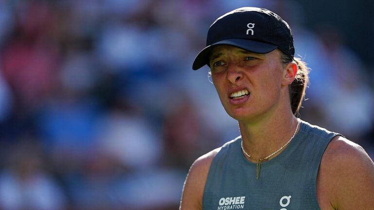 Iga Swiatek looks towards her coach during a BNP Paribas Open quarterfinal match in Indian Wells, Calif., on Thursday, March 12, 2026.